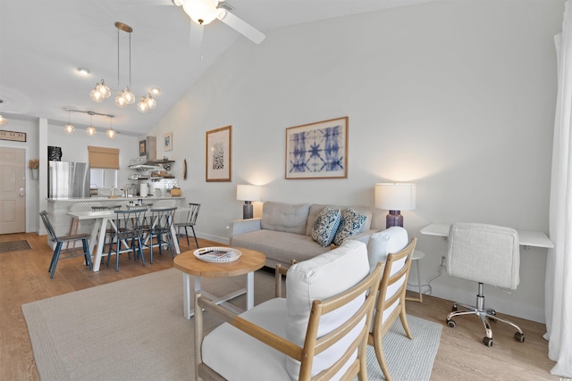 901 W Port Dr Unit 2114, North Myrtle Beach, SC 29582 - living area with light wood-style floors, a ceiling fan, high vaulted ceiling, and beam ceiling