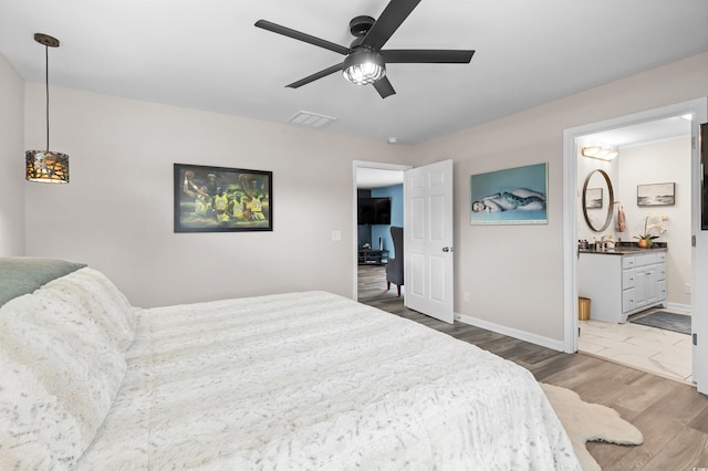 241 Fannie B Rd, Conway, SC 29526 - bedroom with wood finished floors, connected bathroom, and ceiling fan