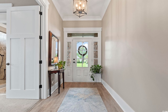 1106 Bluffton Ct, Myrtle Beach, SC 29579 - foyer entrance with a chandelier, light wood-type flooring, and ornamental molding