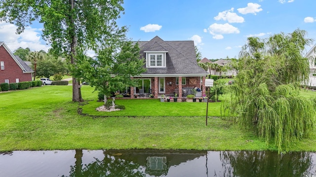 1106 Bluffton Ct, Myrtle Beach, SC 29579 - rear view of property featuring a lawn, a water view, and brick siding