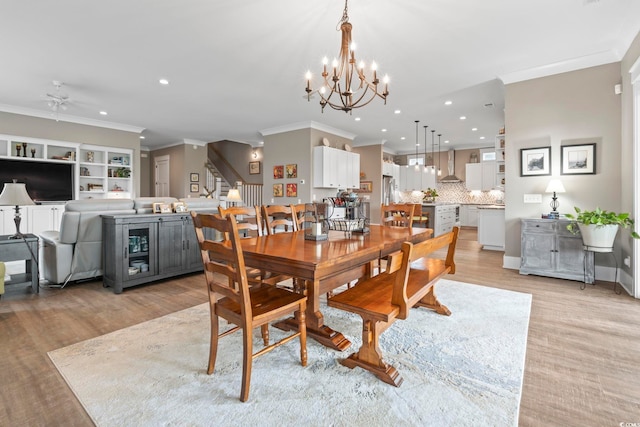1106 Bluffton Ct, Myrtle Beach, SC 29579 - dining room with crown molding, stairway, recessed lighting, light wood finished floors, and a chandelier