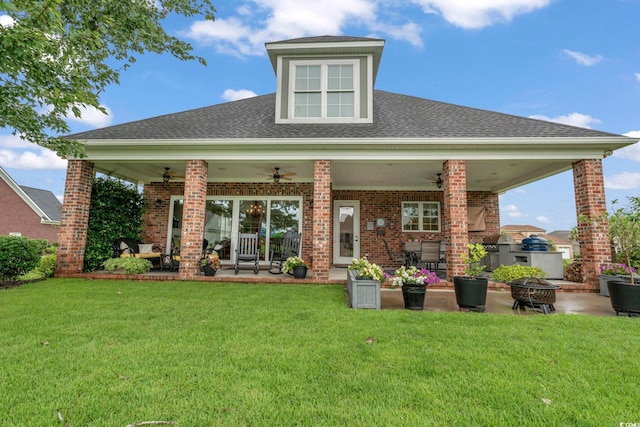 1106 Bluffton Ct, Myrtle Beach, SC 29579 - back of property with ceiling fan, a fire pit, a patio area, and brick siding