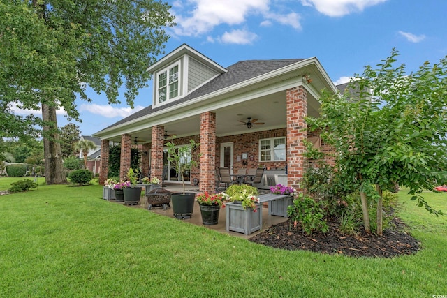 1106 Bluffton Ct, Myrtle Beach, SC 29579 - back of property with a ceiling fan, a patio, brick siding, a lawn, and a shingled roof