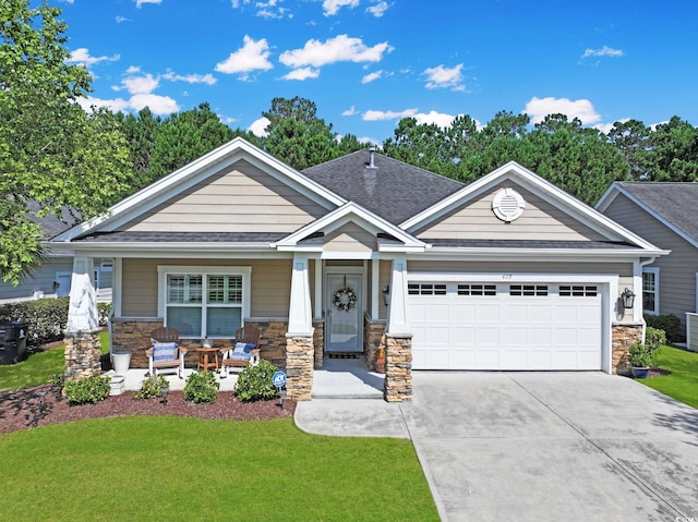 428 Arlington Cir, Murrells Inlet, SC 29576 - craftsman house featuring stone siding, a garage, concrete driveway, and a porch