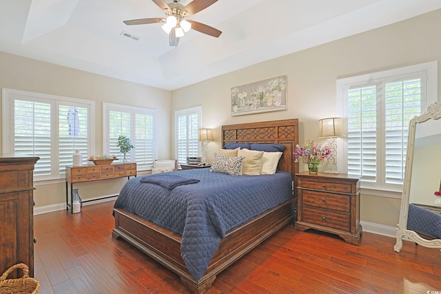 428 Arlington Cir, Murrells Inlet, SC 29576 - bedroom with a raised ceiling, hardwood / wood-style floors, a ceiling fan, and a baseboard radiator
