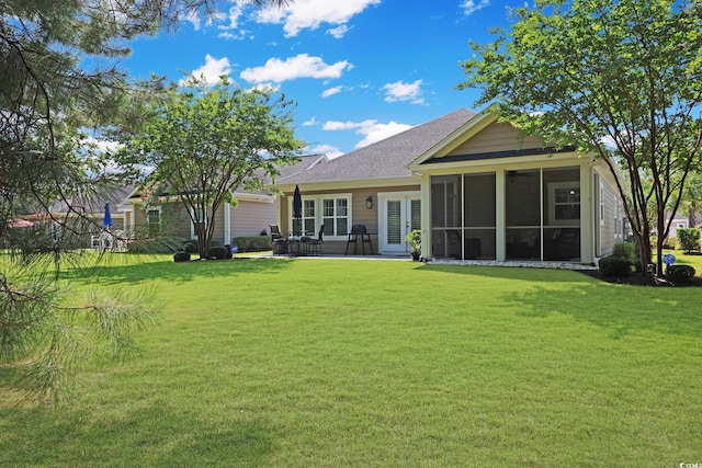 428 Arlington Cir, Murrells Inlet, SC 29576 - rear view of property featuring a lawn, a sunroom, and a shingled roof