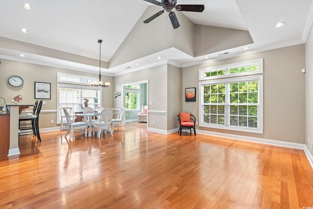 670 2nd Ave N, North Myrtle Beach, SC 29582 - dining area with recessed lighting, vaulted ceiling, light wood-style flooring, a chandelier, and a ceiling fan