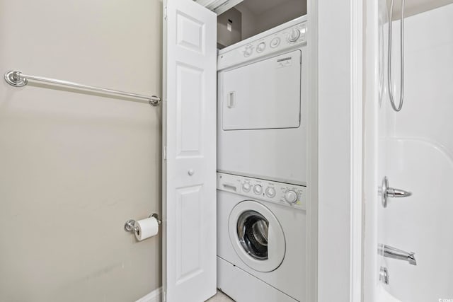 670 2nd Ave N, North Myrtle Beach, SC 29582 - laundry room featuring stacked washer / drying machine