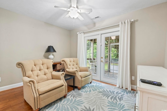 670 2nd Ave N, North Myrtle Beach, SC 29582 - living area with a ceiling fan and wood finished floors
