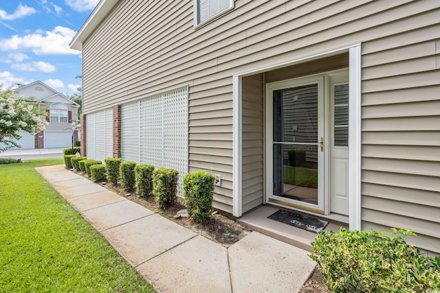 670 2nd Ave N, North Myrtle Beach, SC 29582 - view of exterior entry featuring a yard