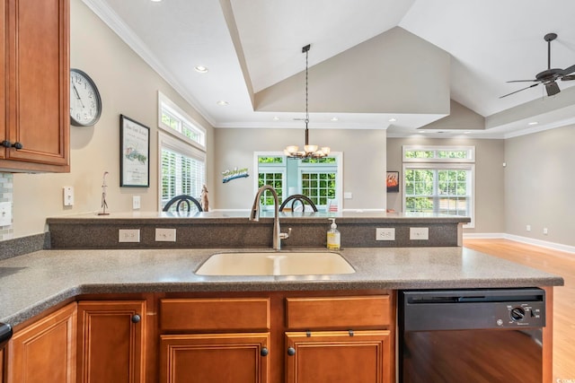 670 2nd Ave N, North Myrtle Beach, SC 29582 - kitchen with dishwasher, vaulted ceiling, a peninsula, light wood-style floors, and brown cabinetry