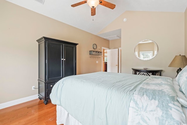 670 2nd Ave N, North Myrtle Beach, SC 29582 - bedroom with light wood-style flooring, vaulted ceiling, and ceiling fan