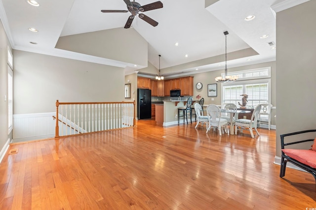 670 2nd Ave N, North Myrtle Beach, SC 29582 - living room featuring a ceiling fan, a chandelier, light wood-style flooring, recessed lighting, and ornamental molding