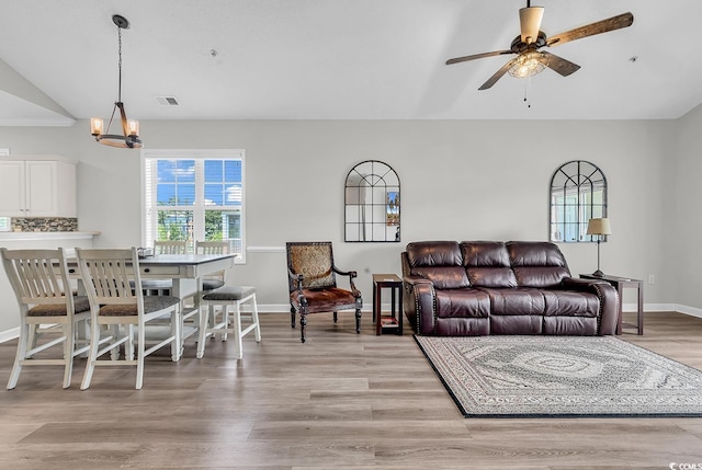 300 Kiskadee Loop Unit K, Conway, SC 29526 - living area featuring a ceiling fan, light wood-style floors, a chandelier, and lofted ceiling