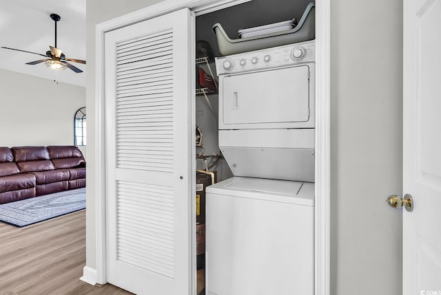 300 Kiskadee Loop Unit K, Conway, SC 29526 - washroom with stacked washer / drying machine, a ceiling fan, and wood finished floors