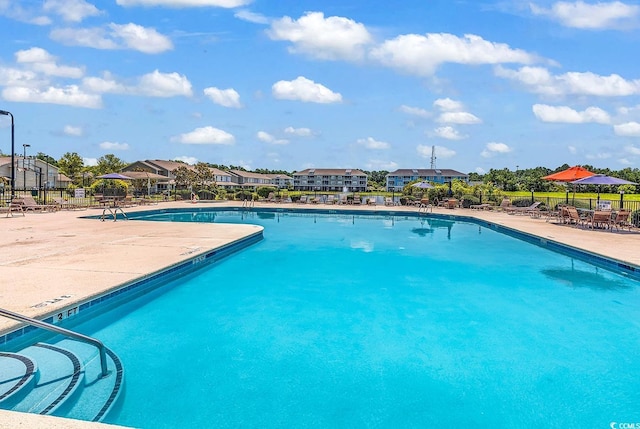 300 Kiskadee Loop Unit K, Conway, SC 29526 - community pool featuring a patio area and a residential view
