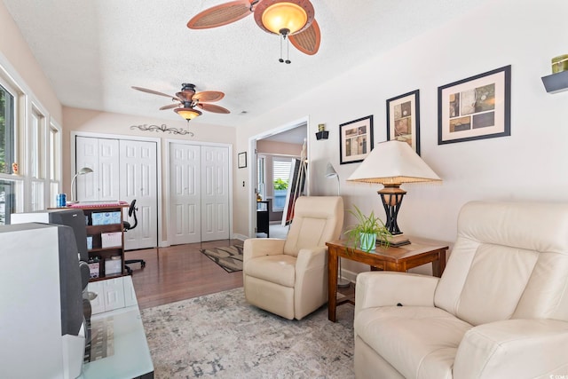 1575 Victoria Ln, Myrtle Beach, SC 29577 - living room featuring a ceiling fan, a textured ceiling, and wood finished floors