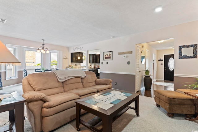 1575 Victoria Ln, Myrtle Beach, SC 29577 - living room with a chandelier and a textured ceiling