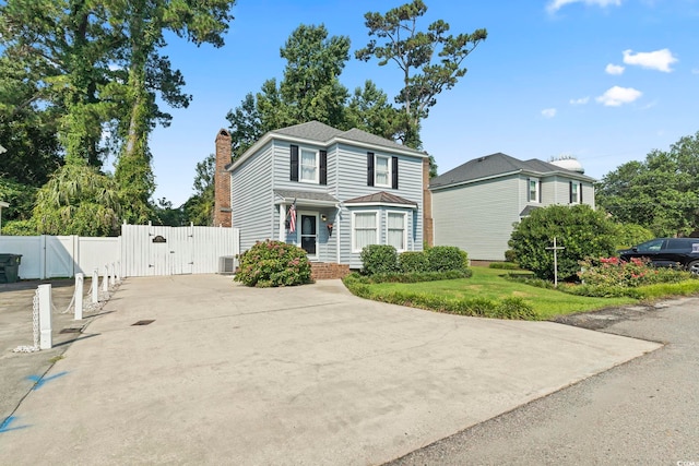 1575 Victoria Ln, Myrtle Beach, SC 29577 - traditional-style house featuring a gate and a chimney