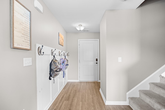317 Truce St, Myrtle Beach, SC 29588 - doorway to outside with wood finished floors and stairway