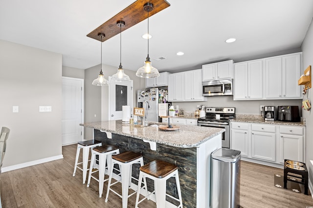 317 Truce St, Myrtle Beach, SC 29588 - kitchen featuring stainless steel appliances, light wood-type flooring, white cabinetry, and recessed lighting