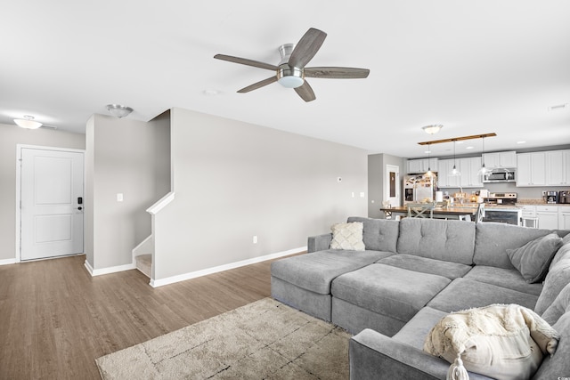317 Truce St, Myrtle Beach, SC 29588 - living area featuring wood finished floors, a ceiling fan, stairway, and recessed lighting