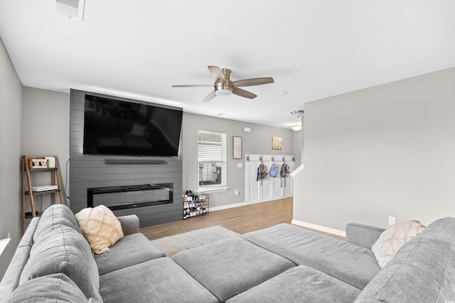 317 Truce St, Myrtle Beach, SC 29588 - living room featuring wood finished floors, a ceiling fan, and a fireplace