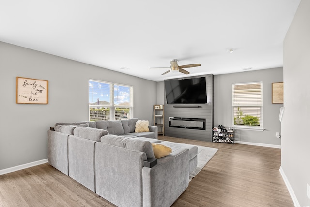317 Truce St, Myrtle Beach, SC 29588 - living room with healthy amount of natural light, ceiling fan, a fireplace, and wood finished floors