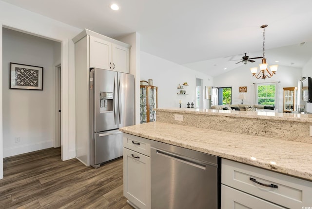 2588 Long Ave, Conway, SC 29526 - kitchen featuring stainless steel appliances, dark wood-style flooring, vaulted ceiling, white cabinetry, and a chandelier