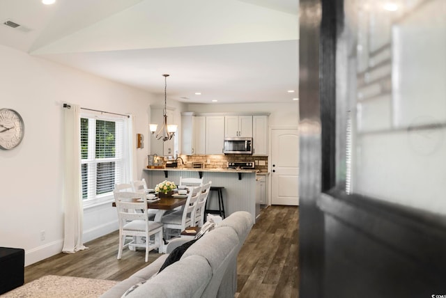 2588 Long Ave, Conway, SC 29526 - dining space featuring dark wood-type flooring, recessed lighting, and a chandelier