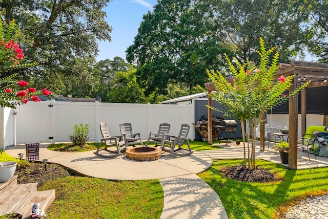 2588 Long Ave, Conway, SC 29526 - fenced backyard featuring an outdoor fire pit, a patio area, and a pergola