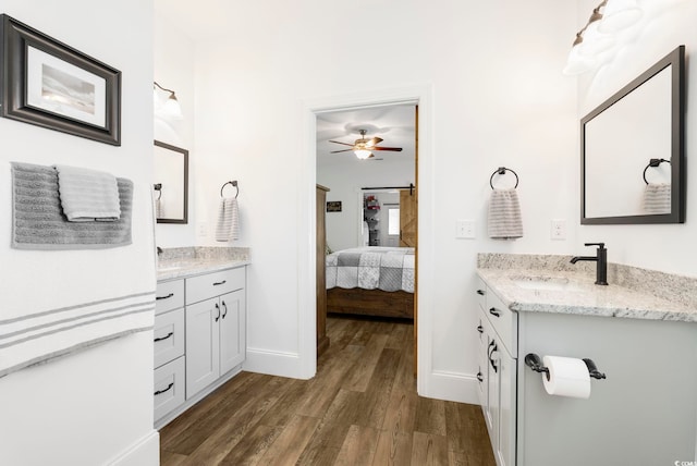 2588 Long Ave, Conway, SC 29526 - ensuite bathroom featuring wood finished floors, two vanities, and a ceiling fan