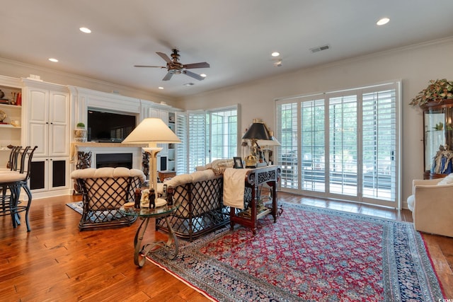 492 Grand Cypress Way, Murrells Inlet, SC 29576 - living area with ceiling fan, ornamental molding, wood finished floors, recessed lighting, and a fireplace