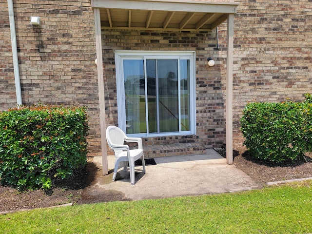 207 Double Eagle Dr Unit E-1, Surfside Beach, SC 29575 - view of exterior entry with brick siding