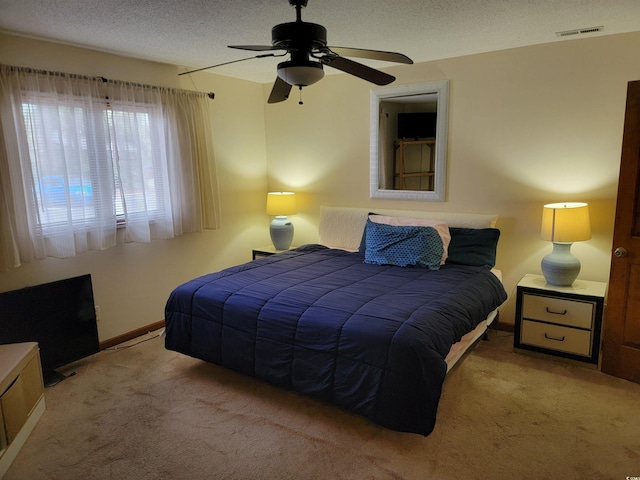 207 Double Eagle Dr Unit E-1, Surfside Beach, SC 29575 - carpeted bedroom featuring a textured ceiling and ceiling fan