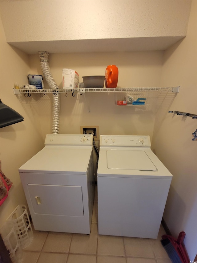 207 Double Eagle Dr Unit E-1, Surfside Beach, SC 29575 - laundry room featuring separate washer and dryer and light tile patterned floors