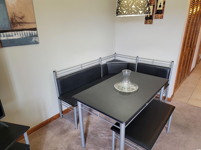 207 Double Eagle Dr Unit E-1, Surfside Beach, SC 29575 - carpeted dining space with baseboards
