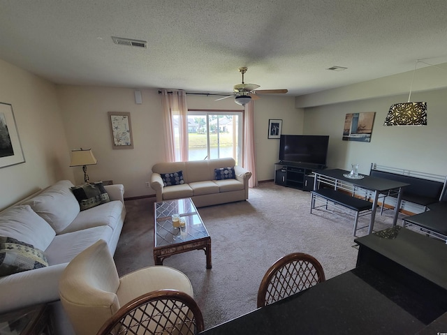 207 Double Eagle Dr Unit E-1, Surfside Beach, SC 29575 - living area with ceiling fan, carpet floors, and a textured ceiling