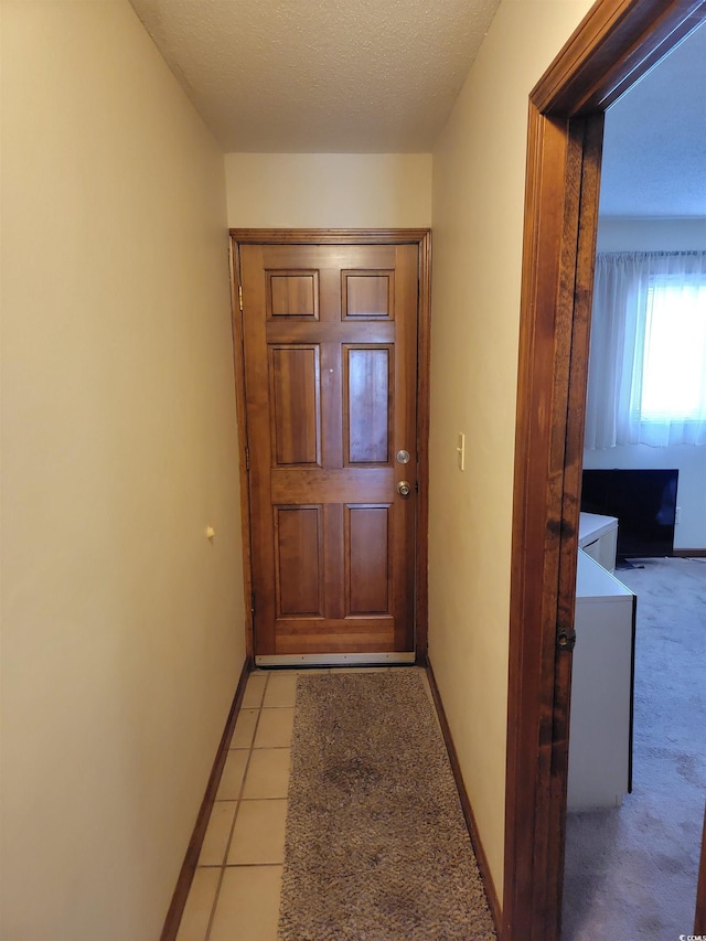 207 Double Eagle Dr Unit E-1, Surfside Beach, SC 29575 - doorway to outside with light carpet and a textured ceiling