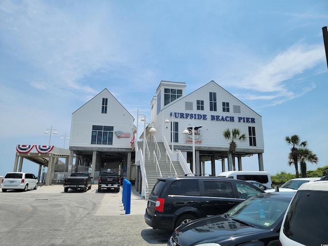 207 Double Eagle Dr Unit E-1, Surfside Beach, SC 29575 - view of commercial property featuring uncovered parking and stairway