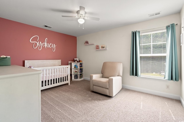 405 Spring View Ct, Little River, SC 29566 - bedroom with a crib, carpet, and a ceiling fan