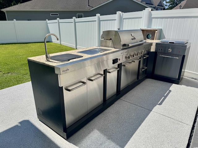 405 Spring View Ct, Little River, SC 29566 - view of patio featuring exterior kitchen