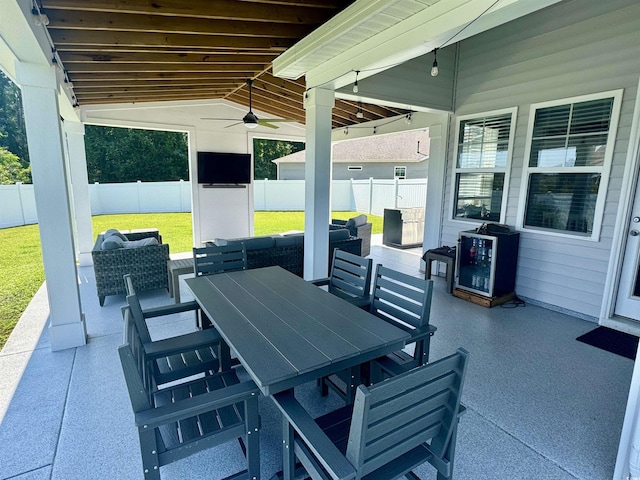 405 Spring View Ct, Little River, SC 29566 - fenced backyard with a patio, outdoor dining area, and ceiling fan