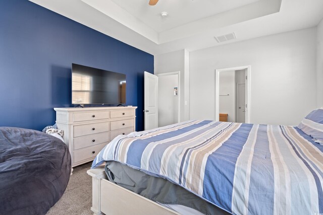 405 Spring View Ct, Little River, SC 29566 - carpeted bedroom with a tray ceiling and a ceiling fan