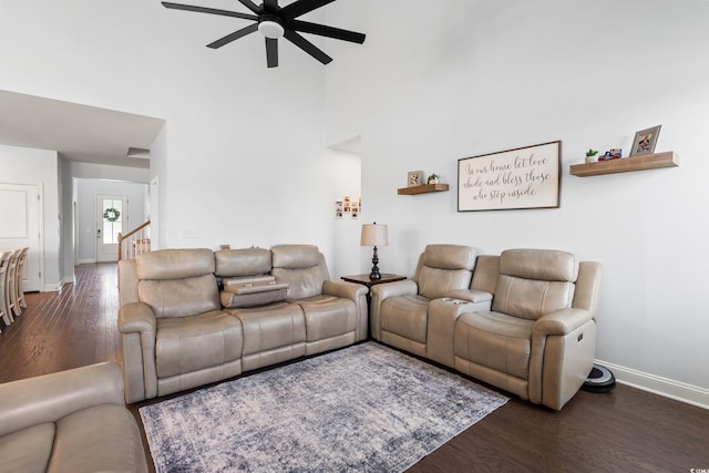 405 Spring View Ct, Little River, SC 29566 - living room featuring ceiling fan, dark wood-style flooring, and a towering ceiling