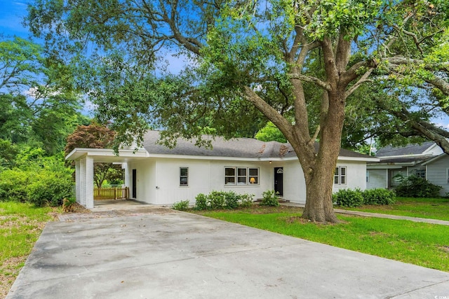 4325 Ellis Ave, Little River, SC 29566 - view of front of property with driveway, stucco siding, an attached carport, and a front lawn
