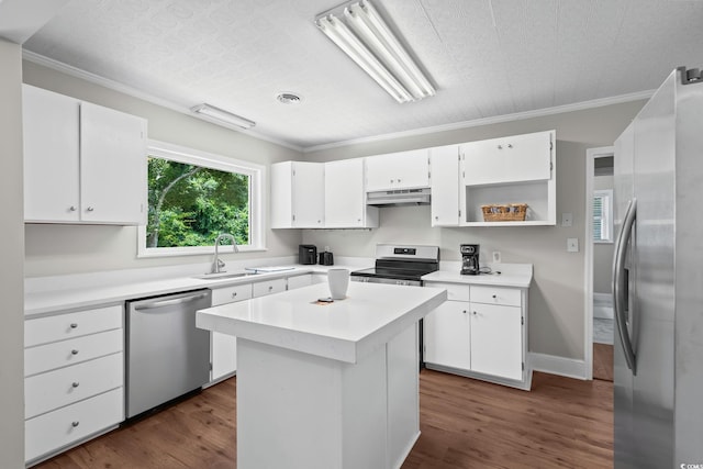 4325 Ellis Ave, Little River, SC 29566 - kitchen featuring stainless steel appliances, under cabinet range hood, white cabinets, light countertops, and crown molding