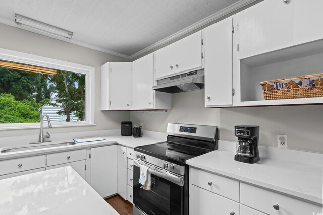 4325 Ellis Ave, Little River, SC 29566 - kitchen with stainless steel electric range oven, under cabinet range hood, light countertops, white cabinetry, and crown molding