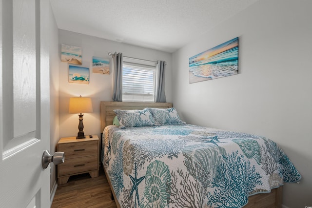 920 N Waccamaw Dr Unit 2310, Murrells Inlet, SC 29576 - bedroom with wood finished floors and a textured ceiling