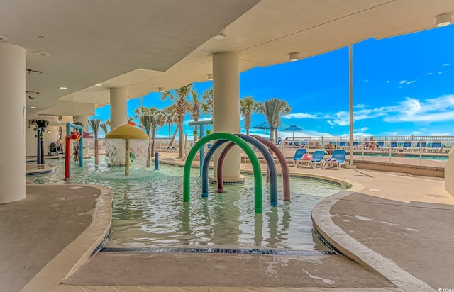 201 S Ocean Blvd Unit 616, Myrtle Beach, SC 29577 - view of property's community with a pool and a patio area